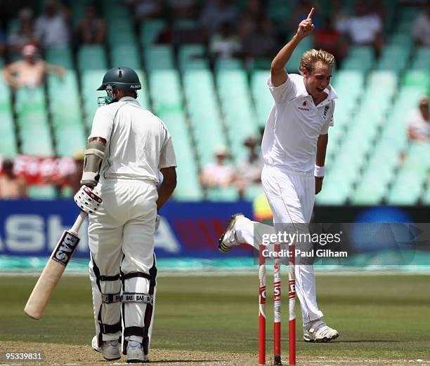 Stuart Broad of England celebrates taking the wicket of Hashim Amla of South Africa for 2 runs during day one of the second test match between South...