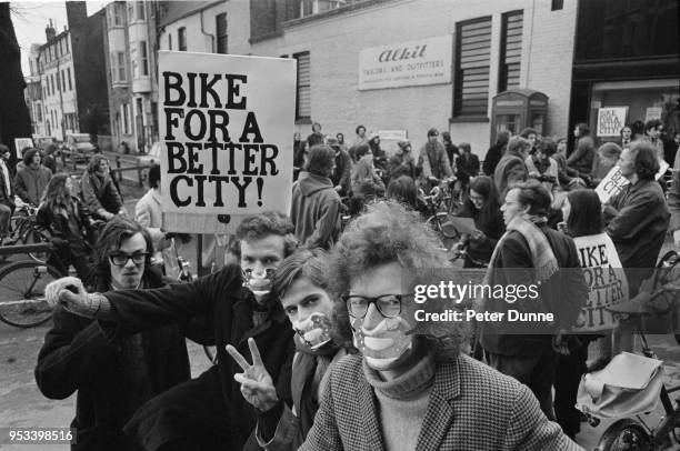 Cyclists holding a placard which says 'Bike for a better city' during a demonstration against pollution in Cambridge, UK, 29th November 1971.