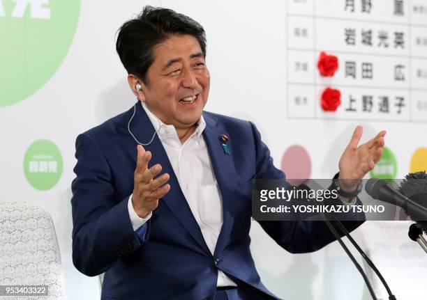 Japanese Prime Minister and ruling Liberal Democratic Party president Shinzo Abe speaks to a TV interview for the result of the Upper House election...