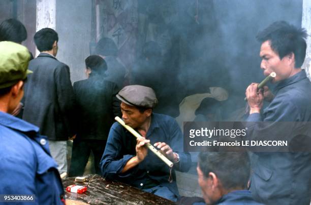 Guangxi district. Flute players in Yangsho village. They are playing for a burial in the village, 1989 in Yangsho Village, China.