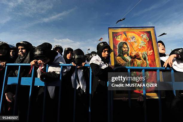 Turkish Shiite girls take part in a religious procession held on the holy day of Ashura, which remembers the slaying of the Prophet Mohammed's...