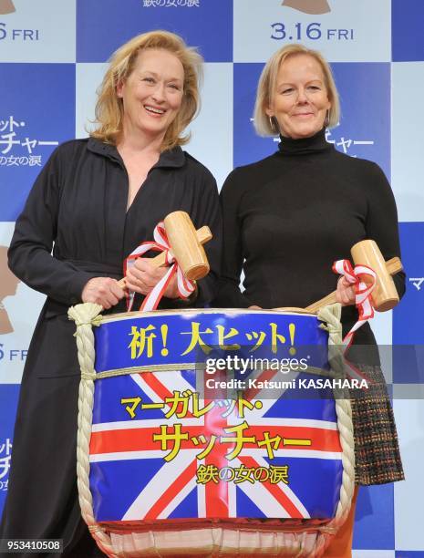 Actress Meryl Streep, winner of the Oscar 2012 for the lead actress , left, and film director Phyllida Lloyd make pose holding wooden hammers during...