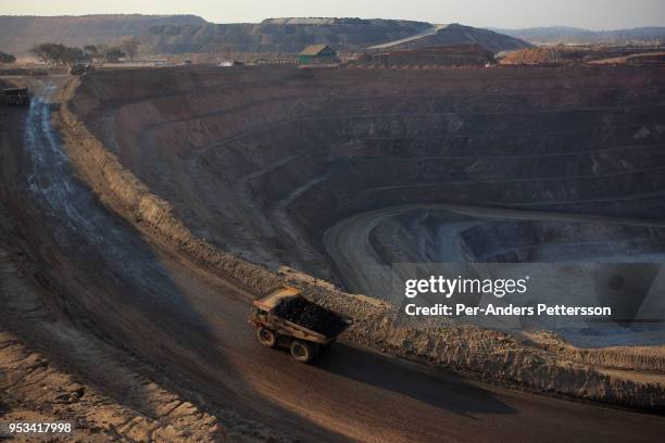 The sun sets on one of the open pit copper mines at Mutanda Mining Sarl on July 6, 2016 in Kolwezi, DRC. The mine is owned by Glencore, an...