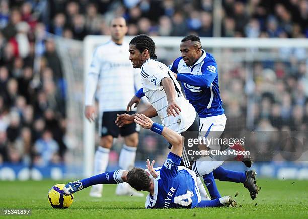 Florent Malouda of Chelsea goes past a grounded Lee Bowyer of Birmingham City during the Barclays Premier League match between Birmingham City and...