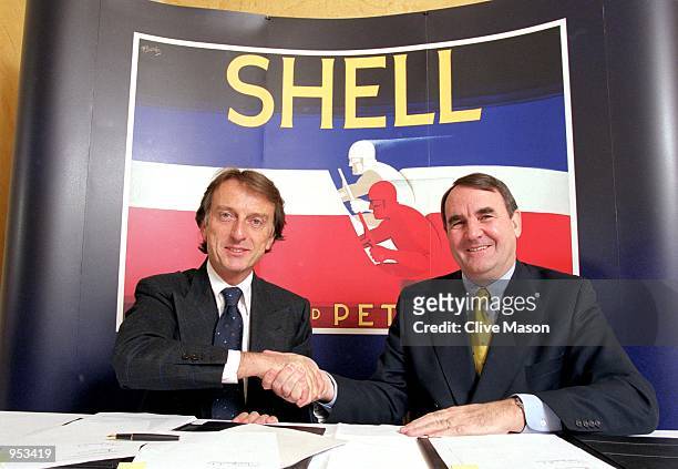 Luca Di Montezemolo, the Chairman of Ferrari and Paul Skinner, the CEO of Shell Oil Products shake hands after signing the Renewal of the Shell and...