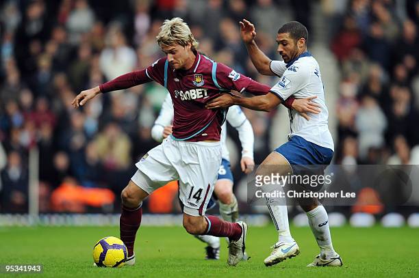 Radoslav Kovac of West Ham United battles for the ball with Hayden Mullins of Portsmouth during the Barclays Premier League match between West Ham...