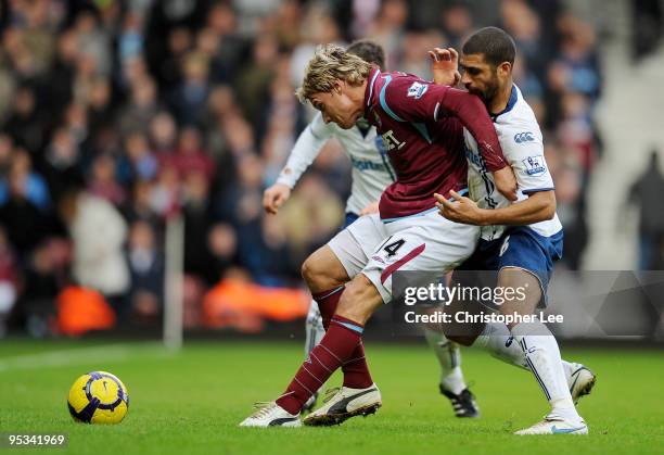 Radoslav Kovac of West Ham United battles for the ball with Hayden Mullins of Portsmouth during the Barclays Premier League match between West Ham...