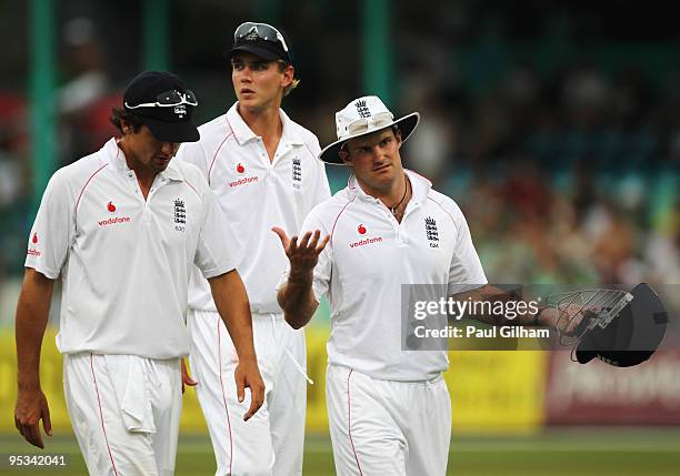 Captain Andrew Strauss shrugs as he walks off alongside Alastair Cook and Stuart Broad after South Africa decided to take the offer of bad light...