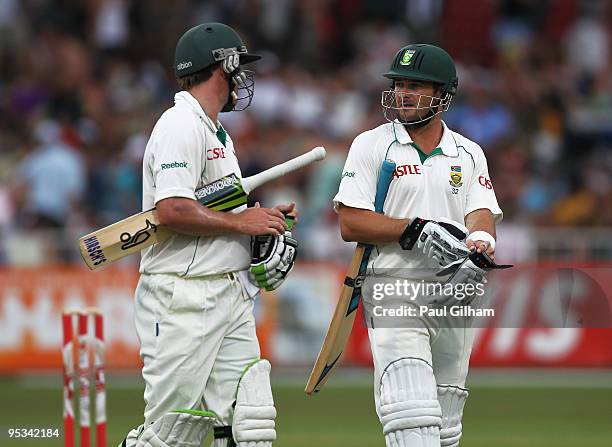 Mark Boucher and AB de Villiers of South Africa walk off after being offered bad light during day one of the second test match between South Africa...