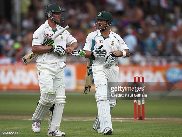 Mark Boucher and AB de Villiers of South Africa walk off after being offered bad light during day one of the second test match between South Africa...
