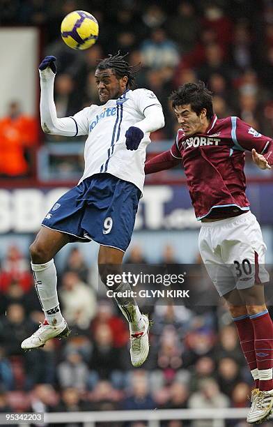 Portsmouth's French striker Frederic Piquionne vies with West Ham's English defender James Tomkins during the English Premier League football match...