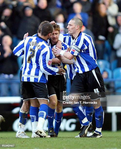 James O'Connor of Sheffield celebrates with team mates after scoring his team's second goal during the Coca-Cola championship match between Sheffield...
