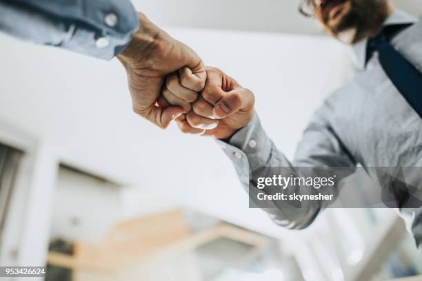 fist bump greeting! - parabéns imagens e fotografias de stock