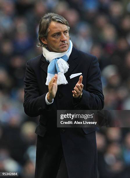 Roberto Mancini the new manager of Manchester City looks on during the Barclays Premier League match between Manchester City and Stoke City at City...