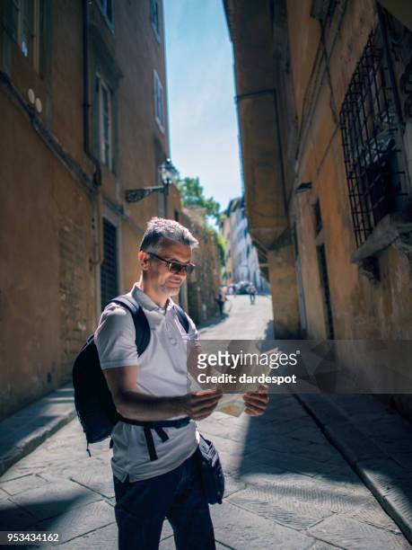 tourist man with map in italy - lazio verona stock pictures, royalty-free photos & images