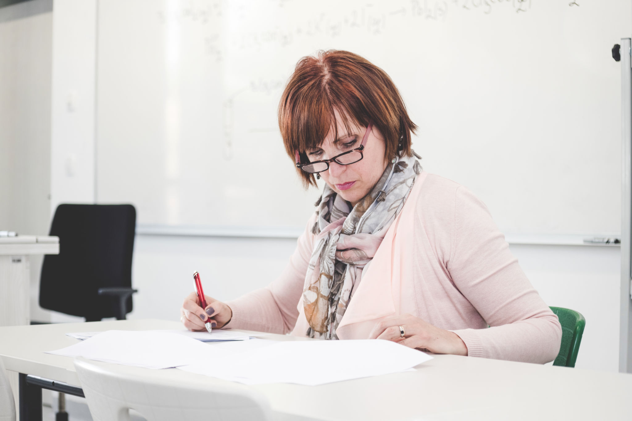 teacher reviewing tests