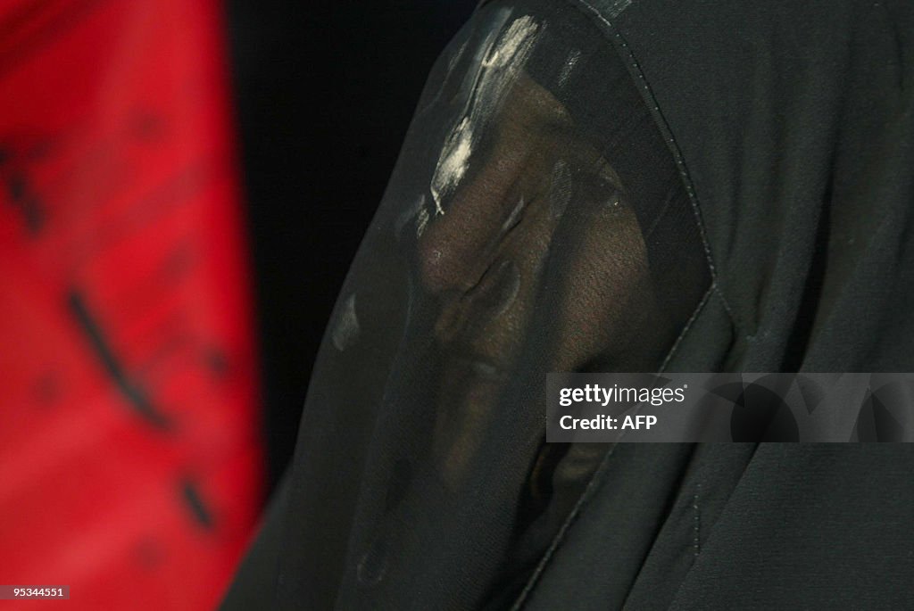 A Shiite Muslim woman with her face cove