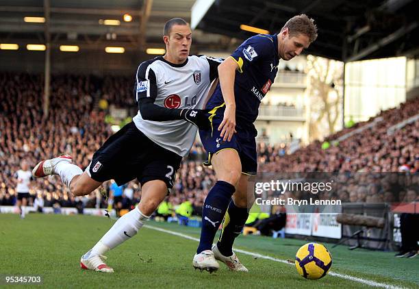 Michael Dawson of Spurs holds off Bobby Zamora of Fulham during the Barclays Premier League match between Fulham and Tottenham Hotspur at Craven...