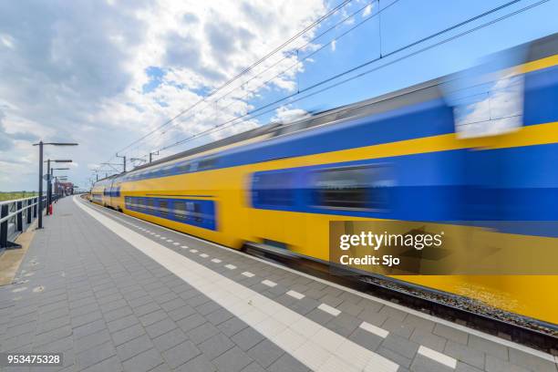 intercity train of the dutch railways, ns, driving past at kampen zuid station - kampen overijssel stock pictures, royalty-free photos & images