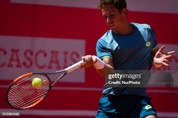 Bjorn Fratangelo from USA returns a ball to Roberto Carballes Baena from Spainduring the Millennium Estoril Open tennis tournament in Estoril,...