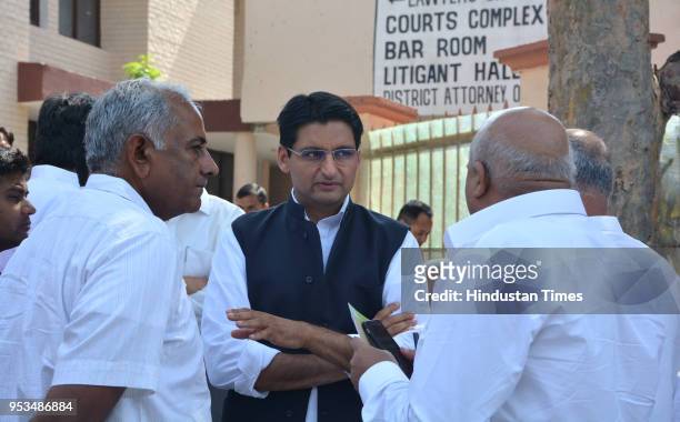 Rohtak MP Deepinder Singh Hooda along with supporters of his father and former Haryana Chief Minister Bhupinder Singh outside the CBI court on May 1,...