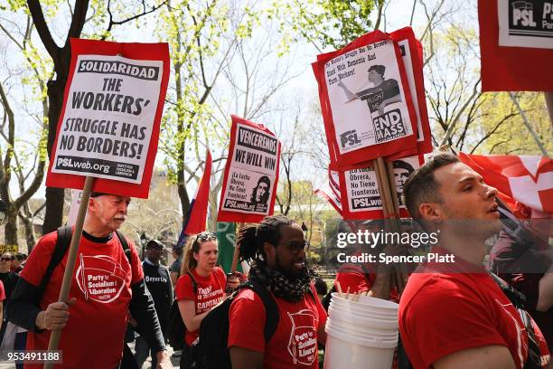 Dozens of people march in May Day protests on May 1, 2018 in New York City. Across the country and world people are protesting, marching and staying...