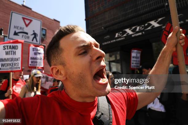 Dozens of people march in May Day protests on May 1, 2018 in New York City. Across the country and world people are protesting, marching and staying...