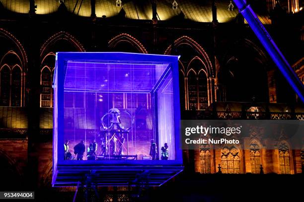 Mammoth skeleton on a lifting platform, part of the installation 'Mammuthus Volantes' by French artist and architect Jacques Rival, is seen behind...