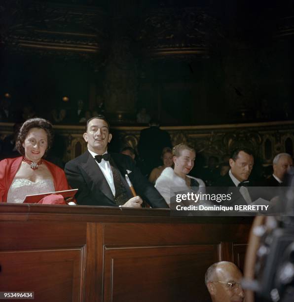 Salvador Dali and wife Gala with actor Eddie Constantine at presentation of Otto Preminger s movie Saint Joan based on French historic heroin Joan of...