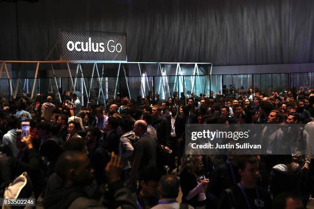 Attendees enter the exhibit hall during the F8 Facebook Developers conference on May 1, 2018 in San Jose, California. Facebook CEO Mark Zuckerberg...