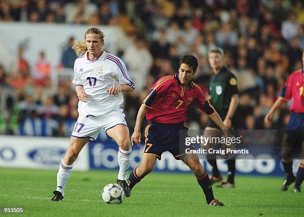 Emmanuel Petit of France holds the ball up against Raul of Spain during the International Friendly match played at the Estadio Mestalla, in Valencia,...