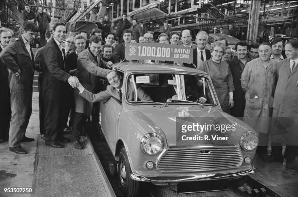 Workers celebrate the production of the millionth Mini Car for export, UK, 8th May 1970.