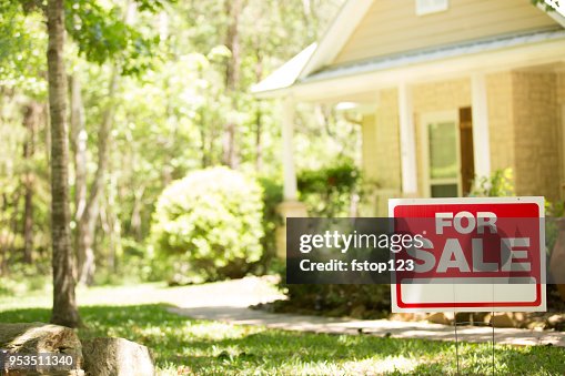 Home for sale with real estate sign. Home for sale with real estate sign.