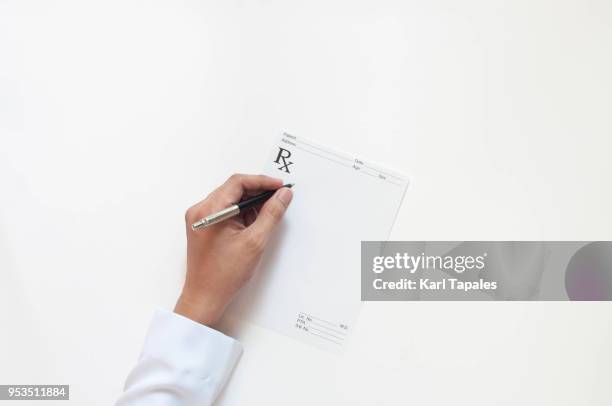 a top view of doctor's hands - receta documento fotografías e imágenes de stock