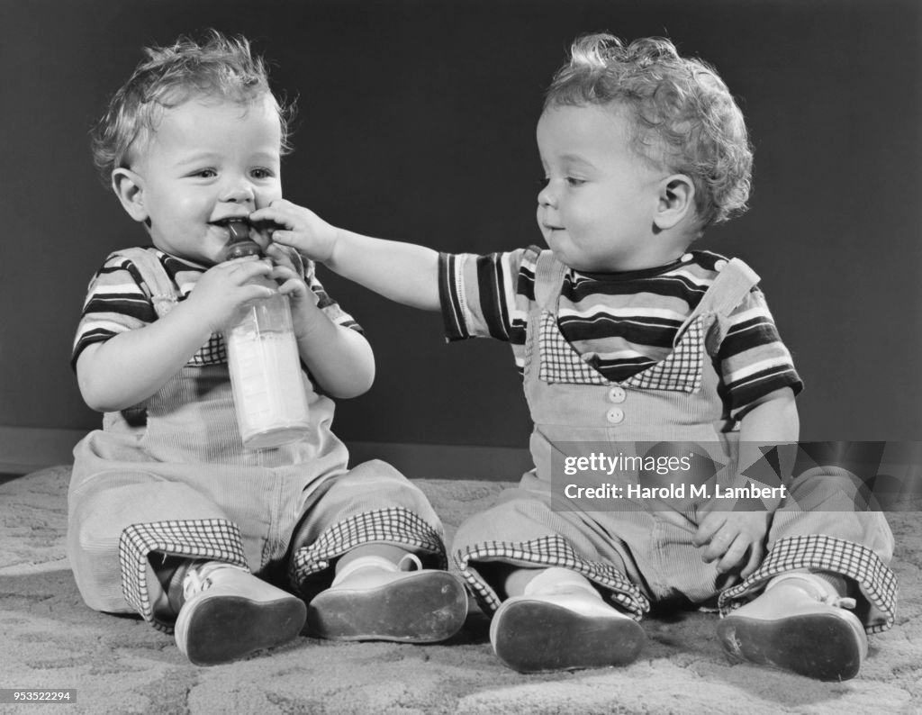 TWIN BABY BOYS DRINKING MILK