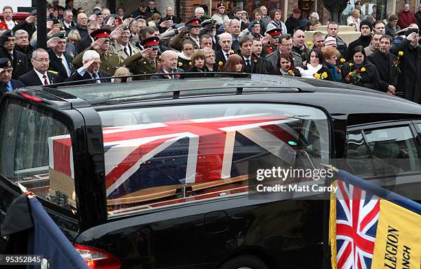 Peoplepay their respects as the hearse carrying the body of Lance Corporal Adam Drane, from 1st Battalion The Royal Anglian Regiment passes mourners...