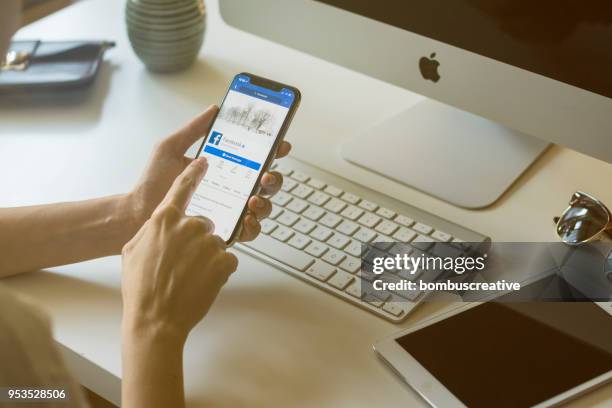 facebook profile on apple iphone x - facebook profile stock pictures, royalty-free photos & images