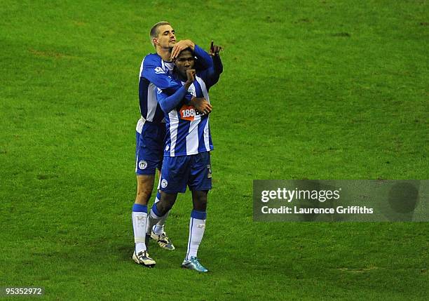 Hugo Rodallega of Wigan is congratulated on his goal by Paul Scharner during the Barclays Premier League match between Wigan Athletic and Blackburn...