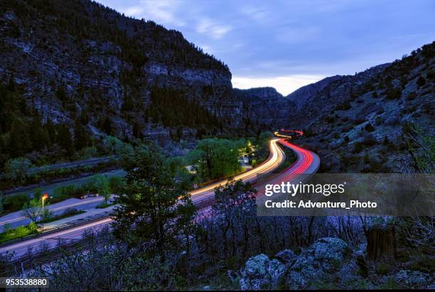 driving at night through glenwood canyon - interstate 70 stock pictures, royalty-free photos & images