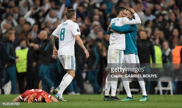 Real Madrid's Portuguese forward Cristiano Ronaldo , Real Madrid's French forward Karim Benzema andReal Madrid's German midfielder Toni Kroos...