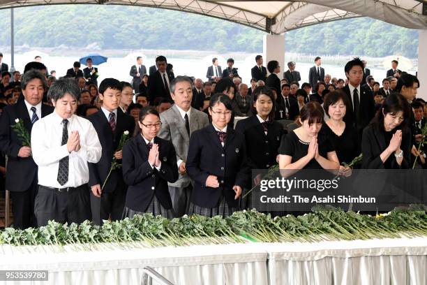 Minamata Disease victims and family members attend a memorial on the 62nd anniversary of the mercury-poisoning disease on May 1, 2018 in Minamata,...