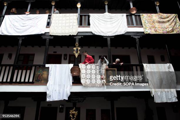 People decorate with shawls and paintings of saints the "Corrala de Santiago" preparing it for the upcoming "Dia de la Cruz". El día de la Cruz or...