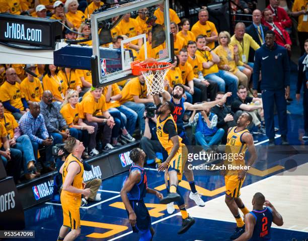 Alex Abrines of the Oklahoma City Thunder reaches for the shot by Royce O'Neale of the Utah Jazz during Game Six of the Western Conference...