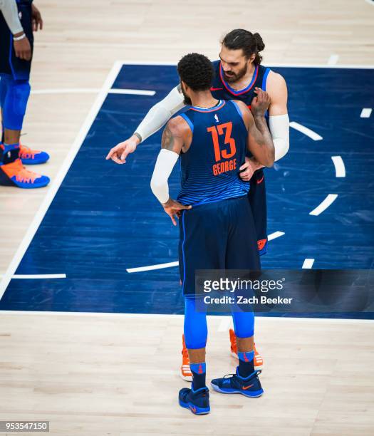 Paul George and Steven Adams of the Oklahoma City Thunder talk during Game Six of the Western Conference Quarterfinals during the 2018 NBA Playoffs...