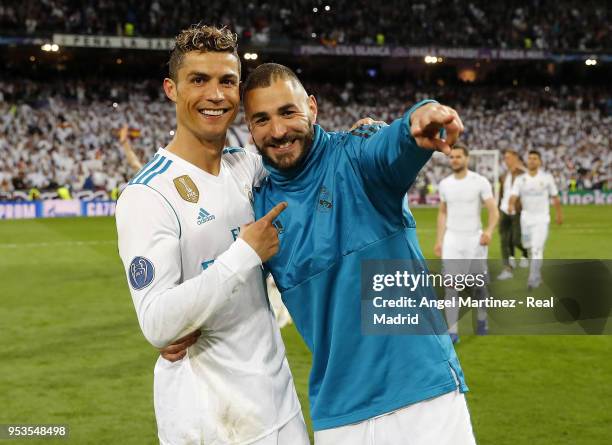 Karim Benzema and Cristiano Ronaldo of Real Madrid celebrate after the UEFA Champions League Semi Final Second Leg match between Real Madrid and...