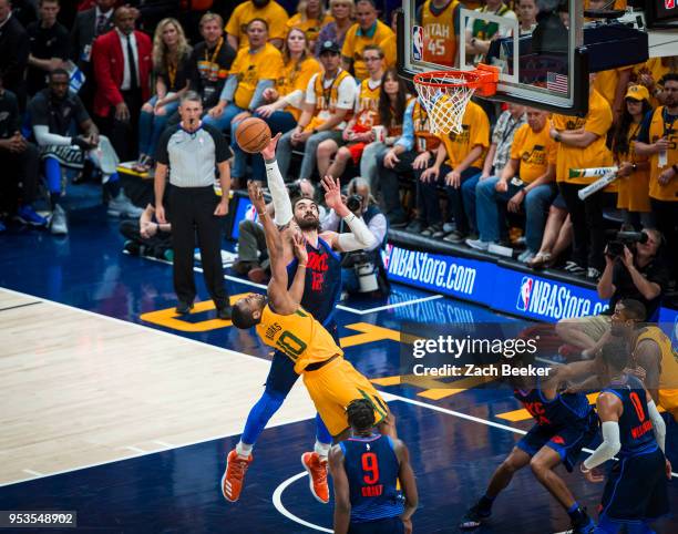 Steven Adams of the Oklahoma City Thunder blocks the shot by Alec Burks of the Utah Jazz in Game Six of the Western Conference Quarterfinals during...