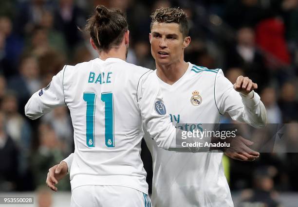 Cristiano Ronaldo and Gareth Bale of Real Madrid celebrate their victory at the end of the UEFA Champions League semi final second leg match between...