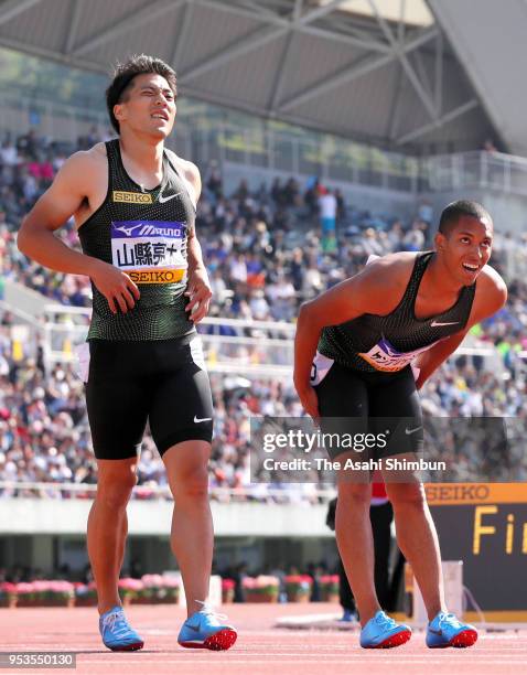 Ryota Yamagata and Aska Cambridge prepare for competing in the Men's 100m during the 52nd Oda Memorial Meet at Edion Stadium Hiroshima on April 29,...