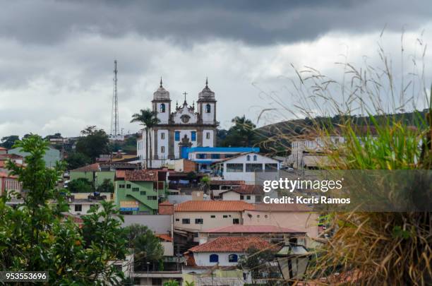 the mother of our lady of the conception was created by the charter of november 6, 1749. the façade has the typical style of the 18th century minas gerais churches, with central door and two windows in the choir. the soapstone stone door, attributed to al - soapstone - fotografias e filmes do acervo