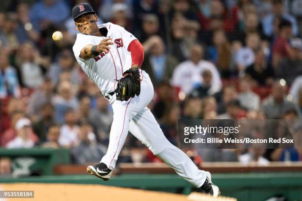 Rafael Devers of the Boston Red Sox throws to first base during the second inning of a game against the Kansas City Royals on May 1, 2018 at Fenway...